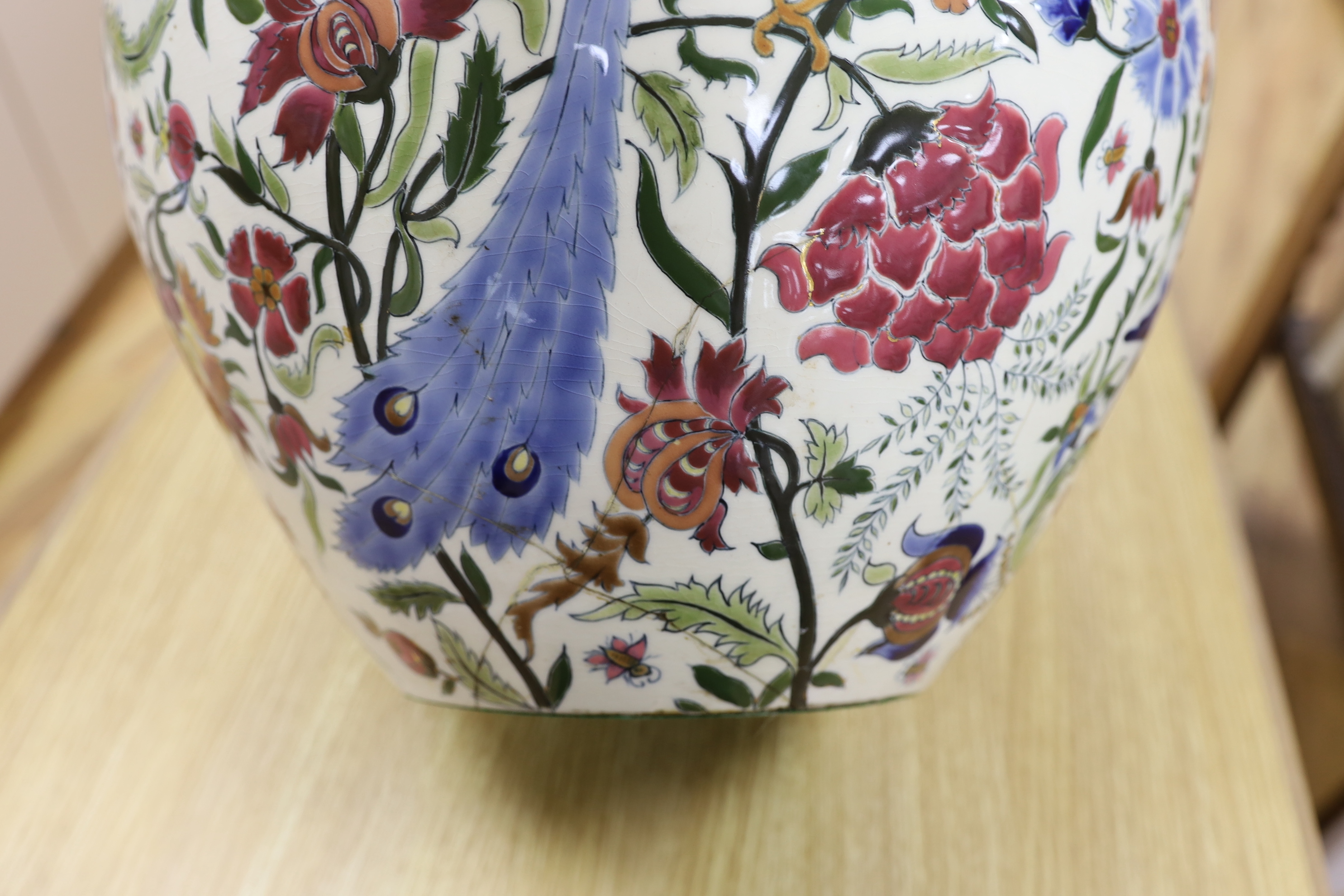 A Zsolnay vase with eight handles, pierced rim and floral decoration with birds, a/f, height 39cm